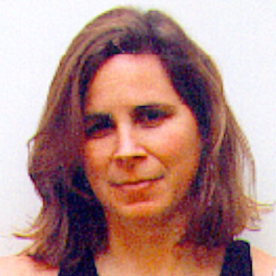 Woman with shoulder-length brown hair